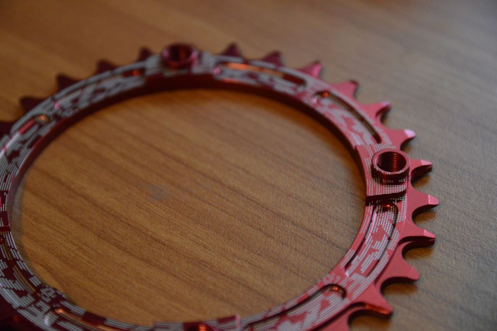 Close-up of how the 30t chainring incorporates mounting threads and offsets the chainring inboard of the spider mountings