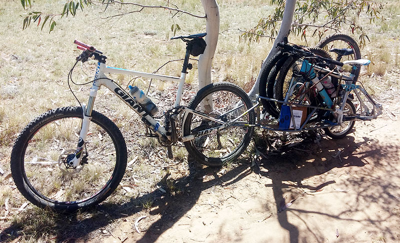 Bob bike trailer carrying two other full suspension mountain bikes