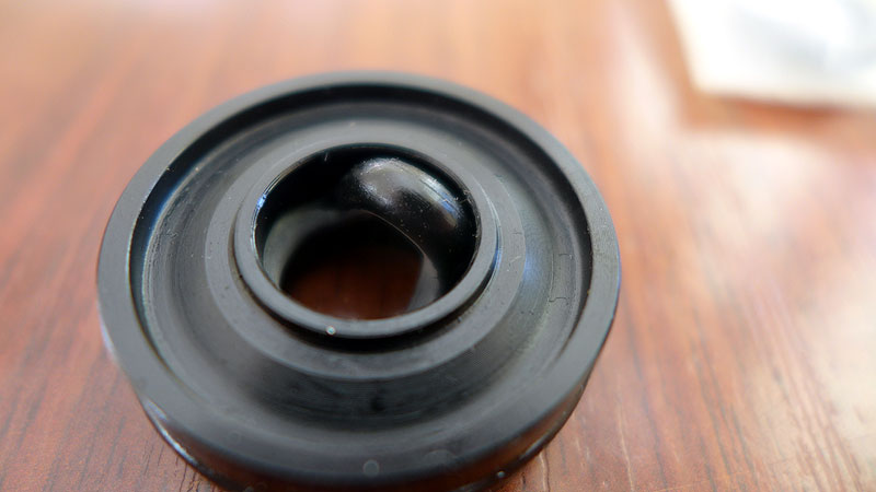 Rebound damper seal head