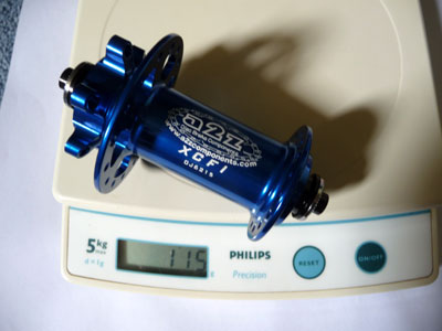 Picture of A2Z front hub on scale weighing 115g